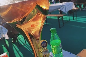 A brass musical instrument, possibly a trumpet, with a visible brand name.
