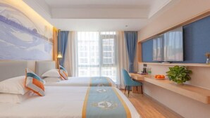 A hotel room with two beds, a desk, a TV, and a large window with curtains. - New Beacon International Hotel (Luotian Tashanhu Park) (Luotian County)