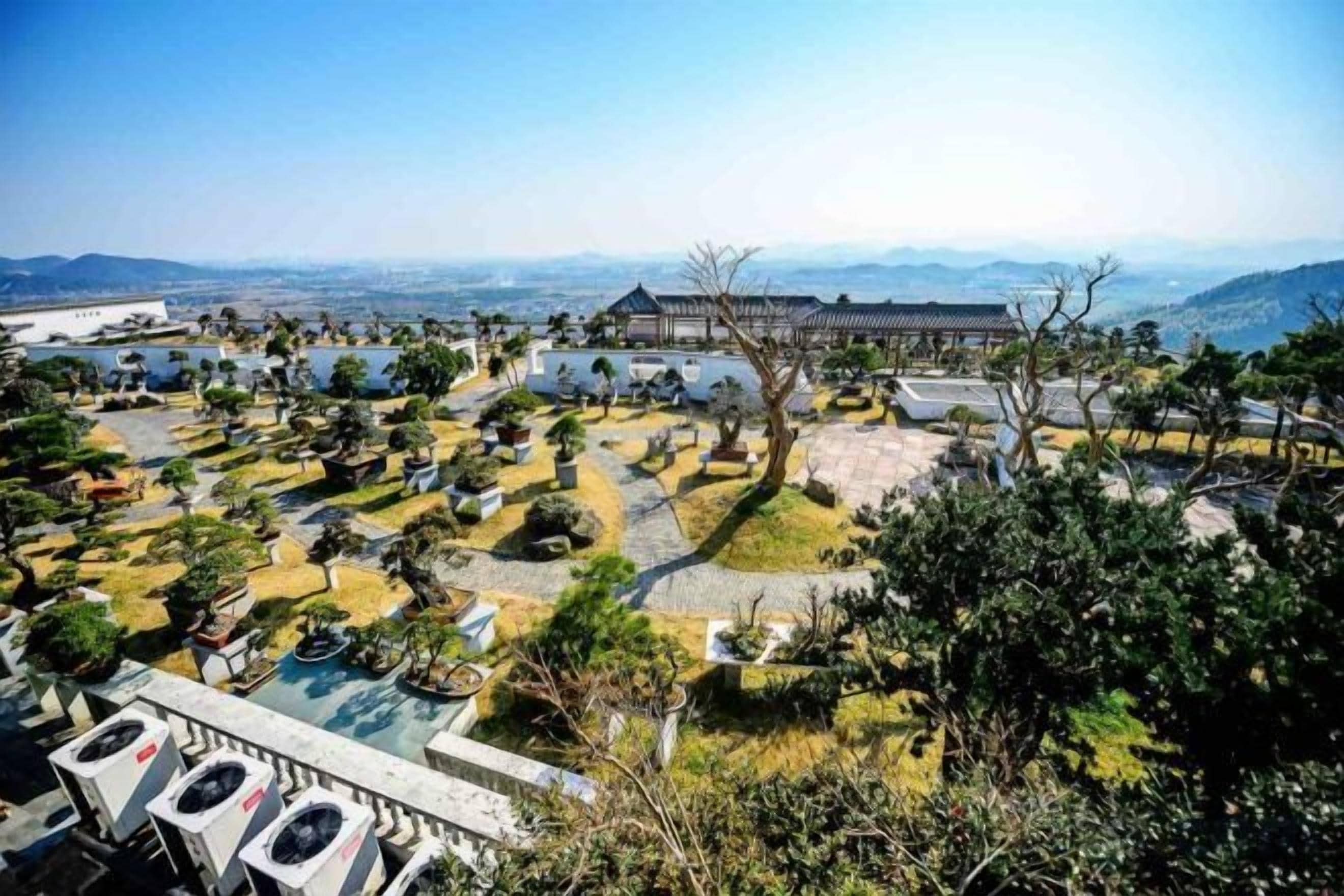 A traditional Korean palace complex with multiple buildings and a large courtyard.