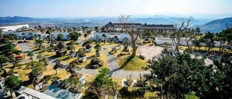 A traditional Korean palace complex with multiple buildings and a large courtyard.