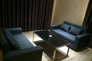 Relax in this inviting space with two sofas arranged around a central coffee table.