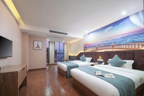 A hotel room with two beds, a TV, a painting of a sunset, and a view of a cityscape. - nanyuan e home hotel （liu an Railway Station Hotel ） ） (Lu'an)