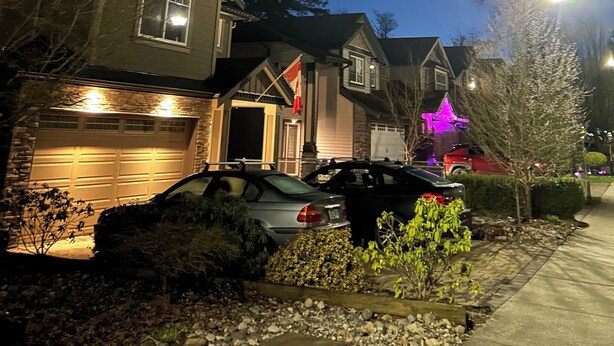 A residential area at night with houses, parked cars, and a visible moon. - Quiet Private suite in a forest setting w/Parking and AC | Maple Ridge (Maple Ridge)