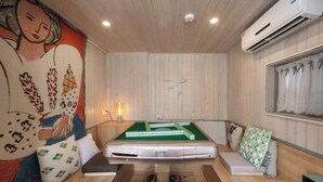 A room with a pool table, a mural, and a window with curtains. - UUINN Villa (Xiamen)