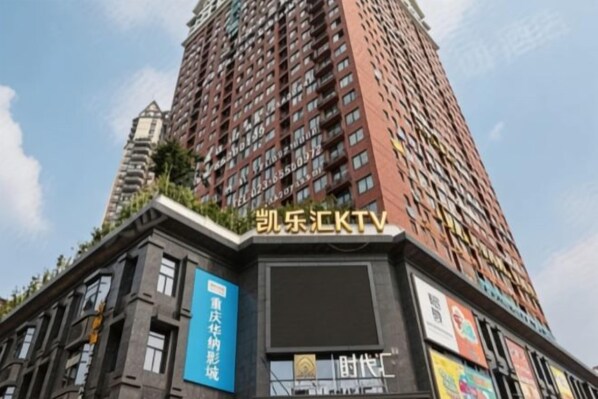 A tall building with a sign that reads 'CCTV' and another sign that says 'Time.'