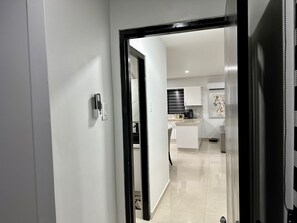 A modern kitchen with a built-in oven, a coffee maker, and a microwave. - Unit 6 house (Oranjestad)