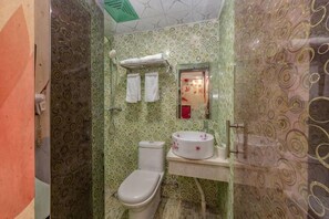 A bathroom with a toilet, sink, and mirror. - Shenli Hostel (Shanghai)