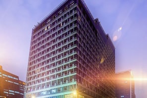 A multi-story building with a grid-like facade, likely a commercial or office building. - Three Gorges Serviced Apartments (Chengdu)