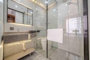 A modern bathroom with a glass shower enclosure, a marble vanity, and a large mirror. - Bu can't thirst Wisdom Hotel (Shanghai)