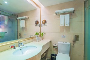 A bathroom with a sink, mirror, toilet, and towel rack. - SOFIS PINGSHAN HOTEL (Fuzhou)