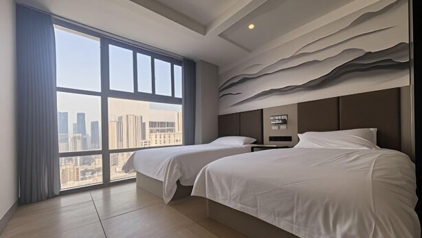 A hotel room with two beds, a large window with a city view, and a textured wall design. - Ningbo Jinhui Business Hotel (Ningbo)