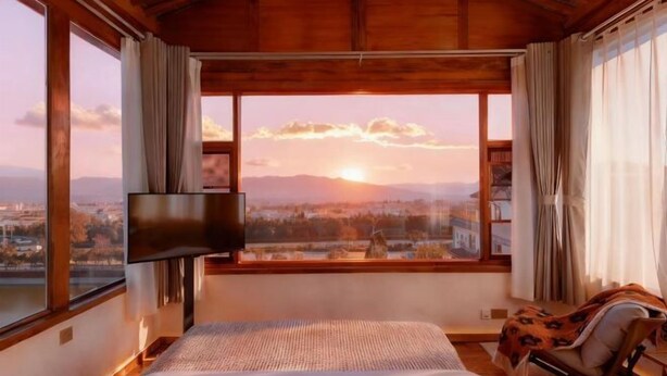 A bedroom with a large window, a bed, a TV, and a chair. - When we first meet (Dali City)