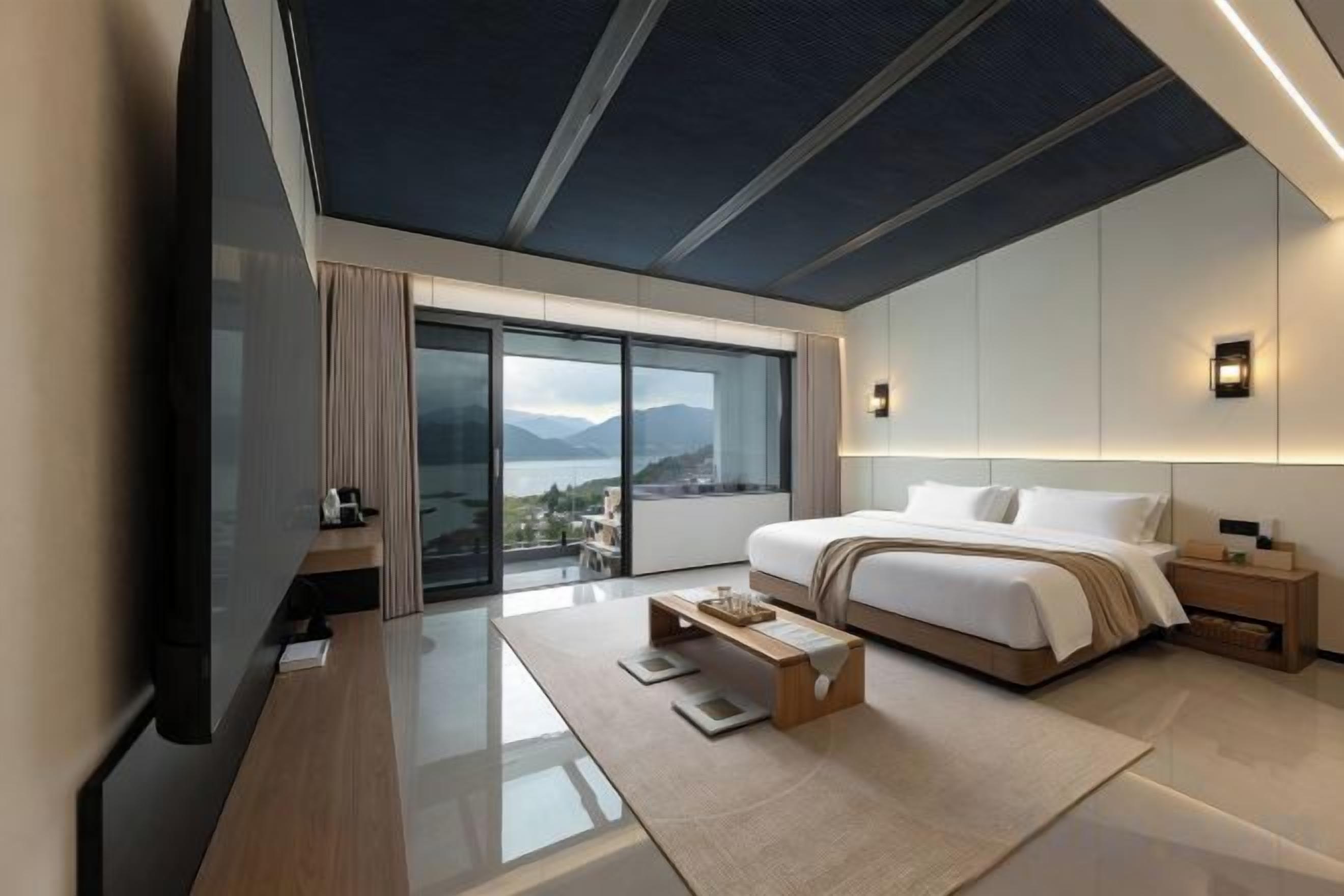 A modern hotel room with a large bed, a desk, and a view of the outdoors.