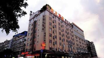 A multi-story hotel with a prominent sign at the top.