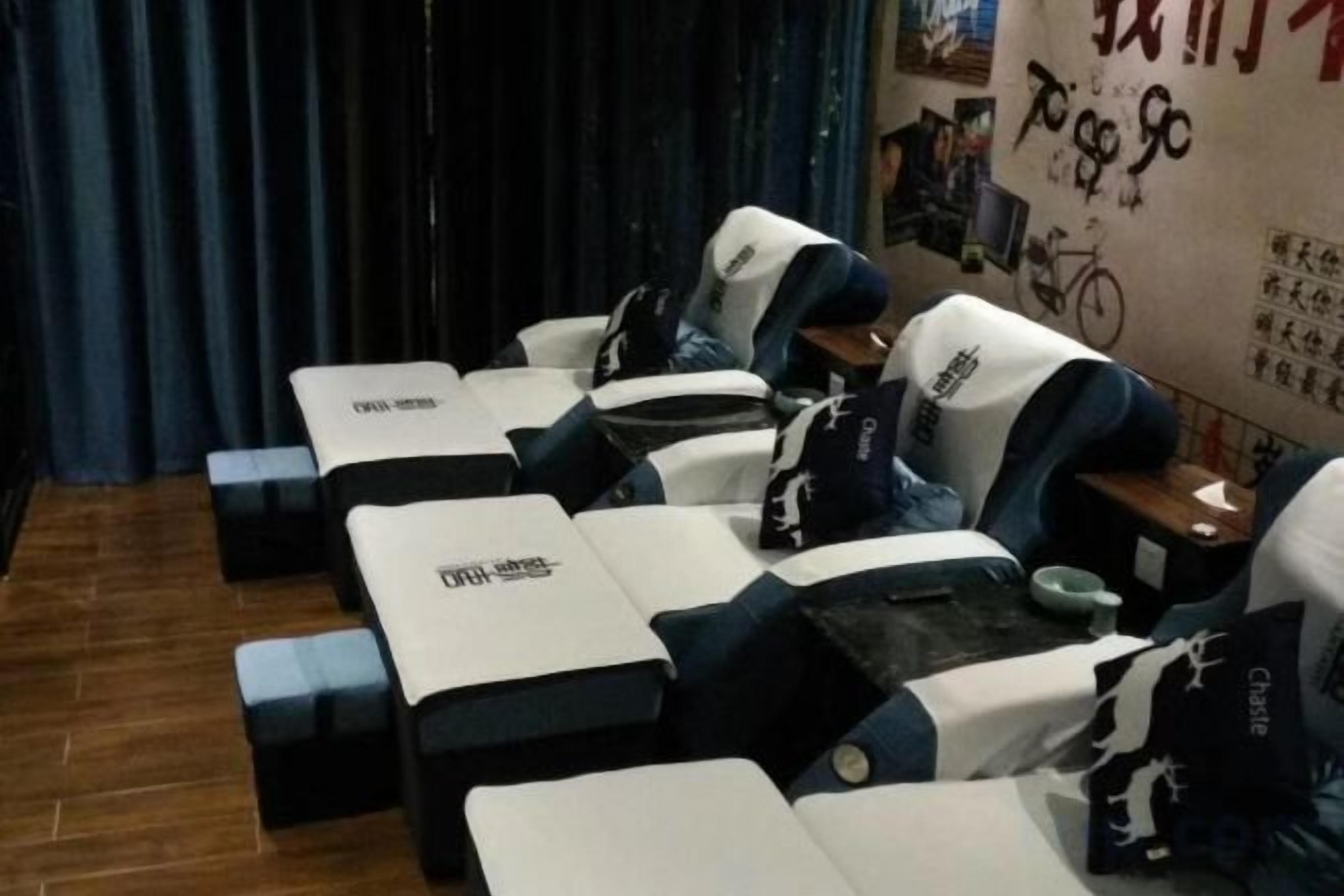 A room with multiple massage therapy tables arranged in a row.