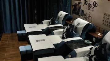 A room with multiple massage therapy tables arranged in a row.