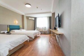A hotel room with two beds, a desk, a chair, a TV, and a window with curtains. - Xinrenren hotel (Shanghai)