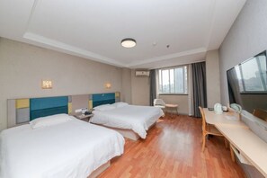 A hotel room with two beds, a desk, a chair, a TV, and a window with curtains. - Xinrenren hotel (Shanghai)