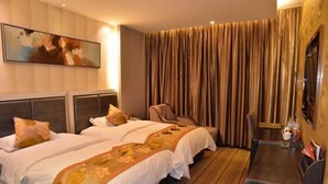 A hotel room with two beds, a large window with curtains, a flat-screen TV, and a small table with a chair. - Sijiwenhua Hotel (Feicheng)
