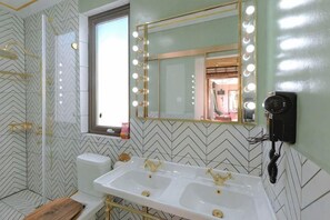 A bathroom with a large mirror, vanity, and a hairdryer on the wall. - Huidong Sumao Homestay (Xunliao Bay) (Huidong)
