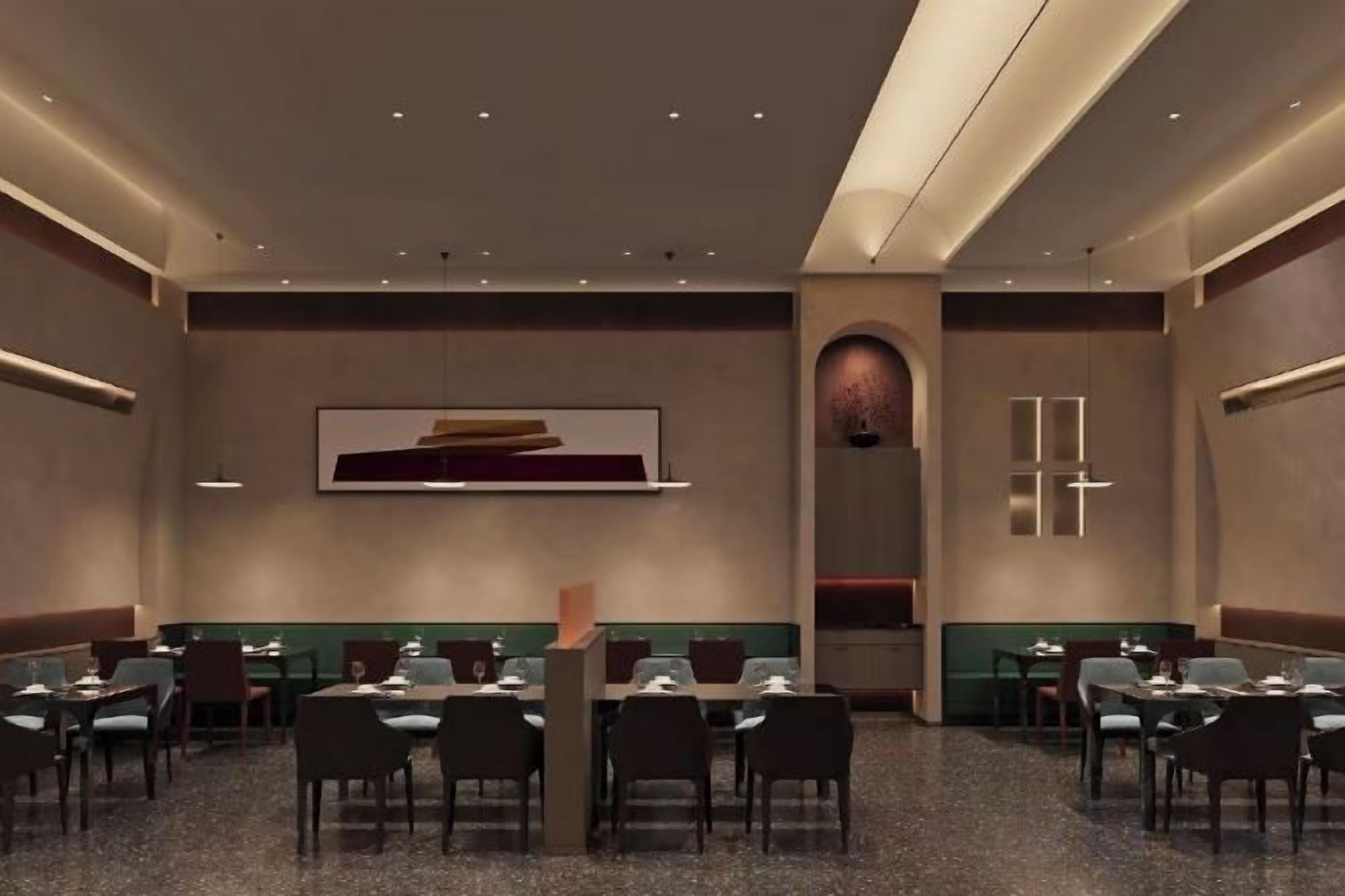 A conference room with tables and chairs, a large abstract painting on the wall, and a modern design.