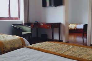 A hotel room with two beds, a desk, and a TV. - Beihu Bay Resort (Shanghai)