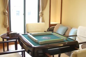 A room with a pool table, a sofa, and a window with curtains. - Jade Jianguo Resort Zhejiang Pan'an (Pan'an)