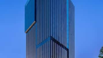Experience the sleek, high-rise Citadines, surrounded by lush greenery in a vibrant urban setting.