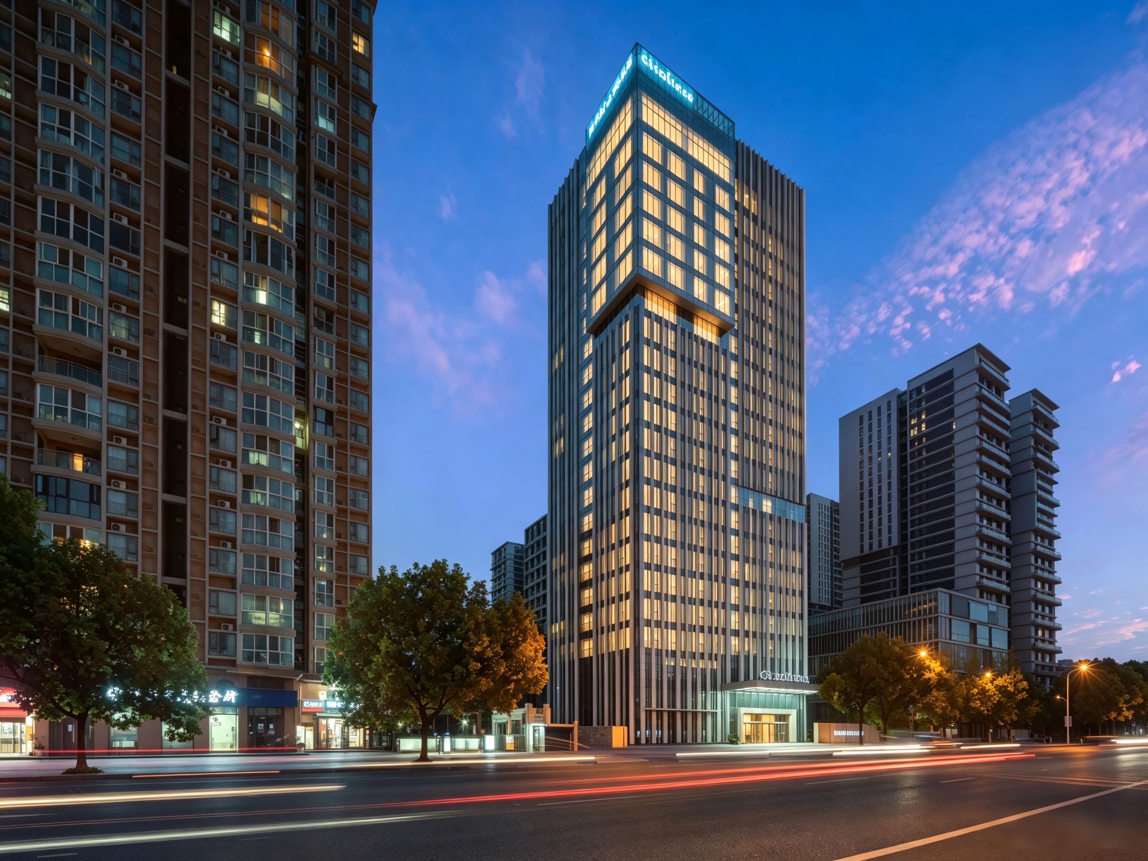 A high-rise building with a modern architectural design, featuring a prominent entrance and a well-lit facade.