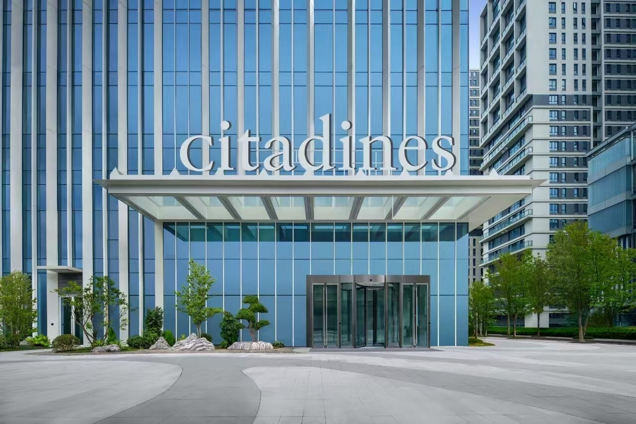 A modern building with the name 'Citadines' prominently displayed on the facade.