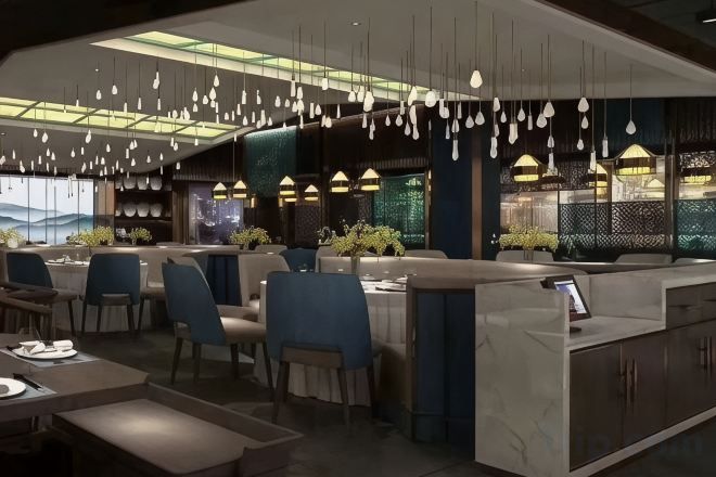 A modern restaurant interior with high ceilings, hanging pendant lights, and a bar area.
