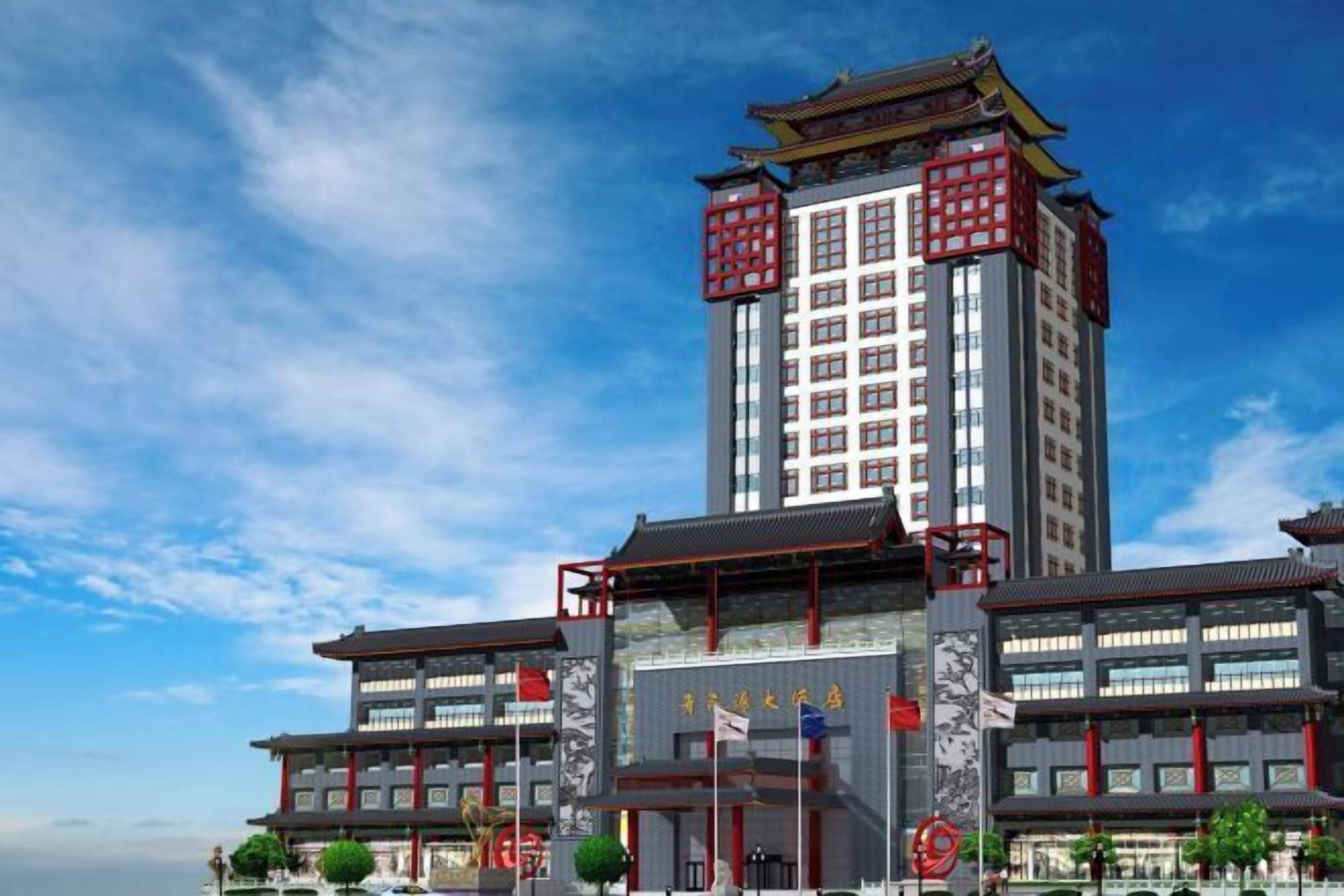 A modern building with traditional architectural elements, featuring multiple floors and a prominent entrance with red accents.