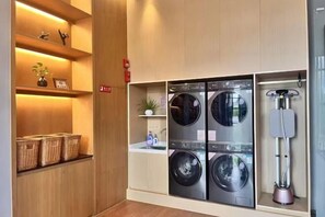 Convenient laundry facilities offer washing machines and a dryer for guest use.