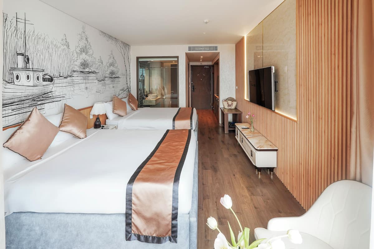 Habitación cuádruple familiar, para no fumadores, vista al mar | 2 habitaciones, artículos del minibar gratis y muebles diferentes