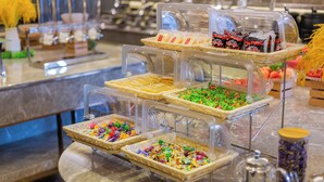 A buffet with various food items in clear containers. - LIZ International Hotel Guangzhou Olympic Sports Center International Financial City Branch - Free Shuttle Bus to Canton Fair Complex During Canton Fair Period (Guangzhou)
