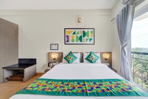 Deluxe Room | Blackout drapes, iron/ironing board, rollaway beds, bed sheets - Treebo Pratham Inn, Manipal (Udupi)