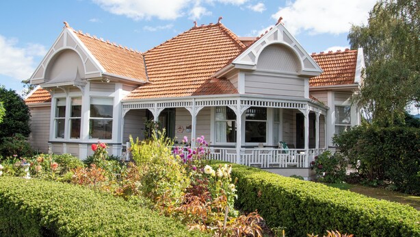 A two-story house with a covered porch and a red-tiled roof. - Anglesea House Inn (Blenheim)
