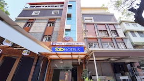 A hotel facade with a prominent sign for Ink Coimbatore and FabHotels. - Fabhotel Ink (Coimbatore)