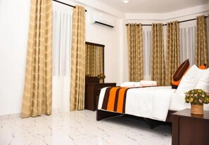 Deluxe Quadruple Room, Garden View | Desk, soundproofing, iron/ironing board, free WiFi - Mamma Raji Hotel (Negombo)