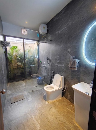 Villa With Bathtub (1BHK) | Bathroom | Shower, rainfall showerhead, designer toiletries, bathrobes. Mango Shack Villa