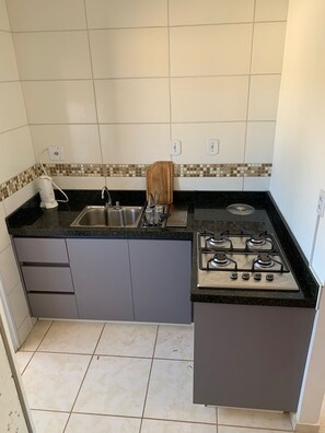 Fridge, microwave, stovetop, coffee/tea maker