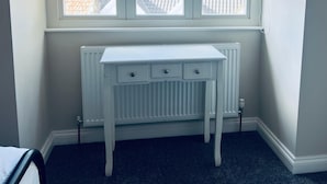 A room with a white radiator, a window with two panes, and a white desk with drawers. - 25A Moonstone House in Thetford (Thetford)