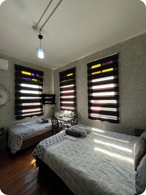 Triple Room | Minibar, iron/ironing board, free WiFi, bed sheets