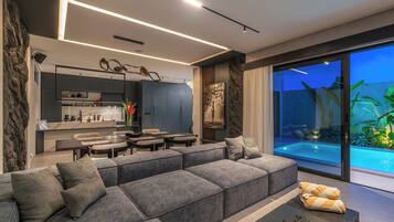 Luxury Villa, Patio, Pool View | Living room | Flat-screen TV