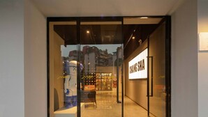 A modern storefront with glass doors, a visible interior with shelves of products, and a sign reading "CHANG & DANA". - Mcsrh Hotel-Changsha Shaoshanbeilu (Changsha)