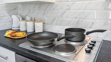 Fridge, stovetop, cookware/dishes/utensils, spices