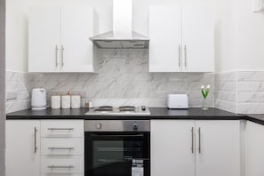 Fridge, stovetop, cookware/dishes/utensils, spices