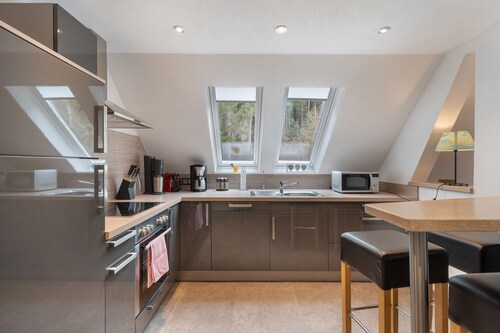 Ferienwohnung mit 2 Schlafzimmern mit privater Terrasse, Balkon und Garten