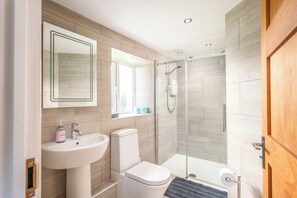 Shower, eco-friendly toiletries, towels, soap
