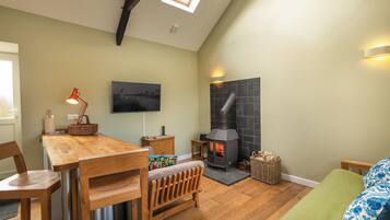 Log burner, basket of wood provided